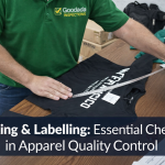 Apparel quality inspector from Goodada Inspections checking T-shirt measurements during packing and labelling inspection